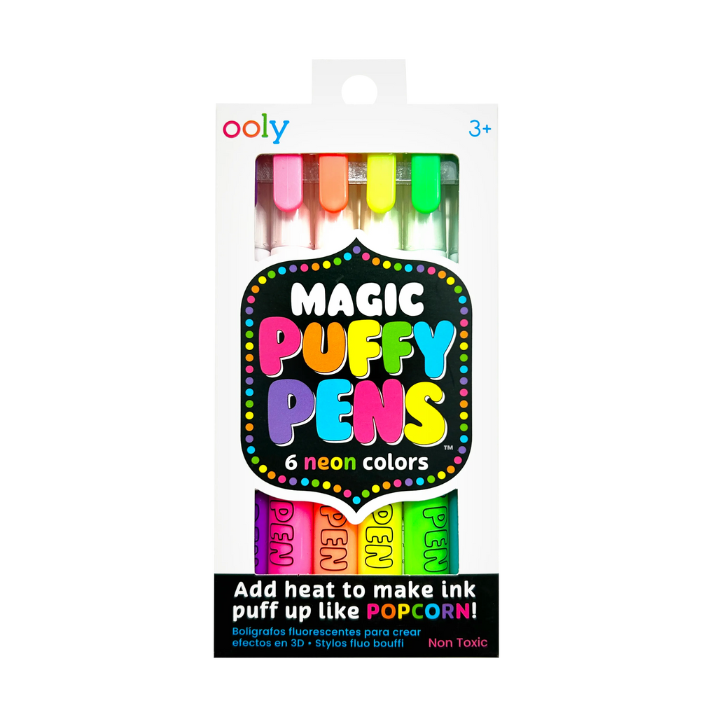 Ooly Magic Puffy Pens in a white retail box, showing six neon-coloured pens visible through a clear window. The packaging features colourful text and graphics, and the pens inside are shown in pink, orange, yellow, green, blue, and purple.