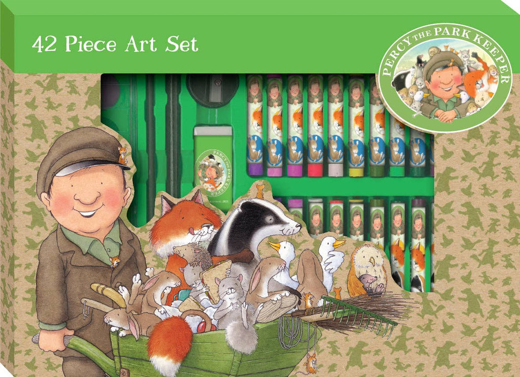A 42-piece art set box featuring Percy the Park Keeper illustration on the front, with crayons and colored pencils visible inside a green case. The packaging includes woodland animals in a wheelbarrow and a circular Percy logo.