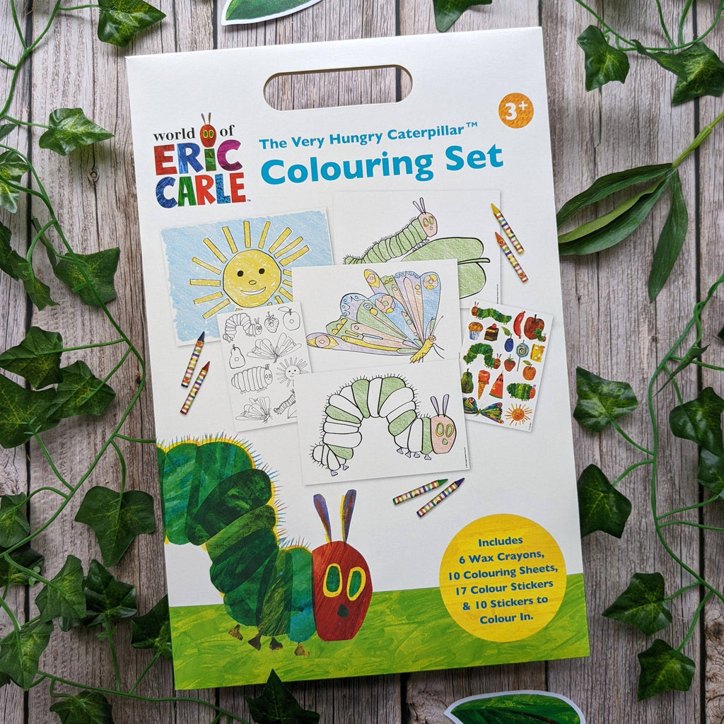 World of Eric Carle The Very Hungry Caterpillar Colouring Set packaging on a wooden surface with leaves.